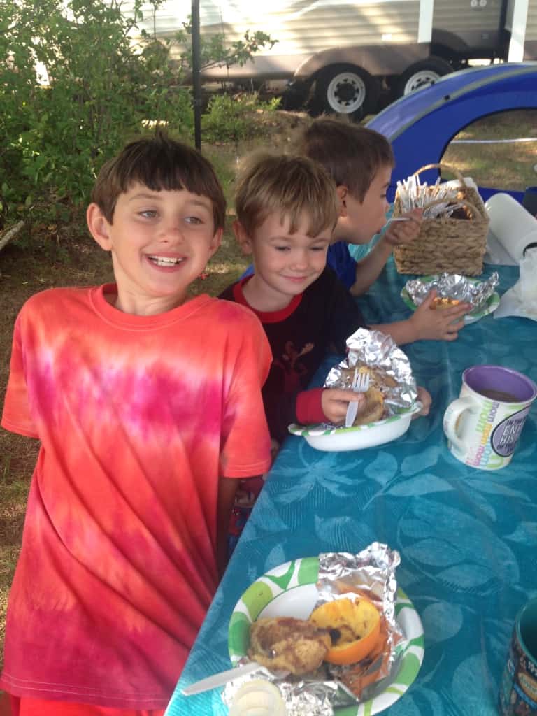 This is a fun way to cook cinnamon rolls while camping and no burnt bottoms! Oranges and Cinnamon rolls bake up on the grill! Super Ooey-gooey good! #CinnamonRolls #CookingWhileCamping #CookingOverTheGrill #GrillCooking #CampCooking #Campingwithkids #CampKids #OrangeCinnamonRolls