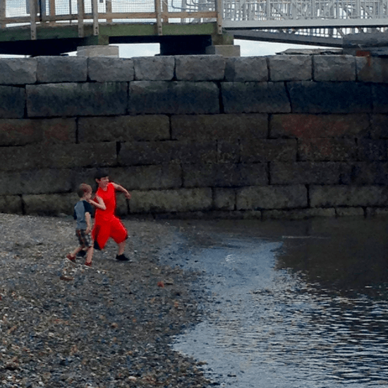 Throwing rocks into Boston Harbor on George's Island 