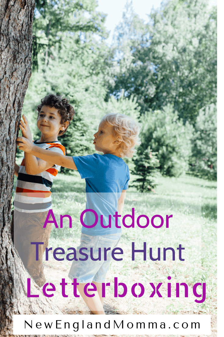 two boys searching a tree for letterboxing