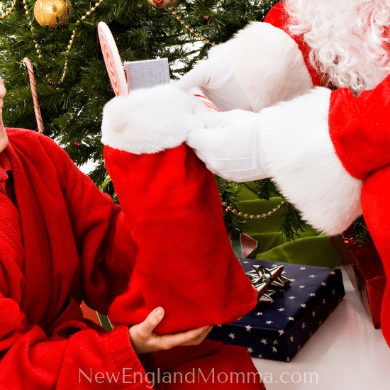 Santa giving a stocking on Christmas Day 