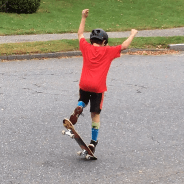 a 12 year old boy on his skate board 