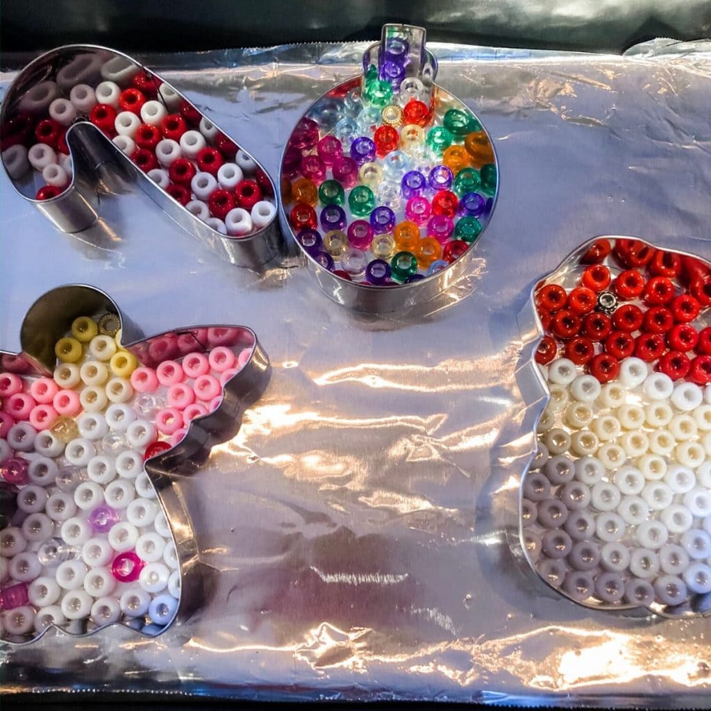 Christmas themed ornaments with colorful pony beads in them