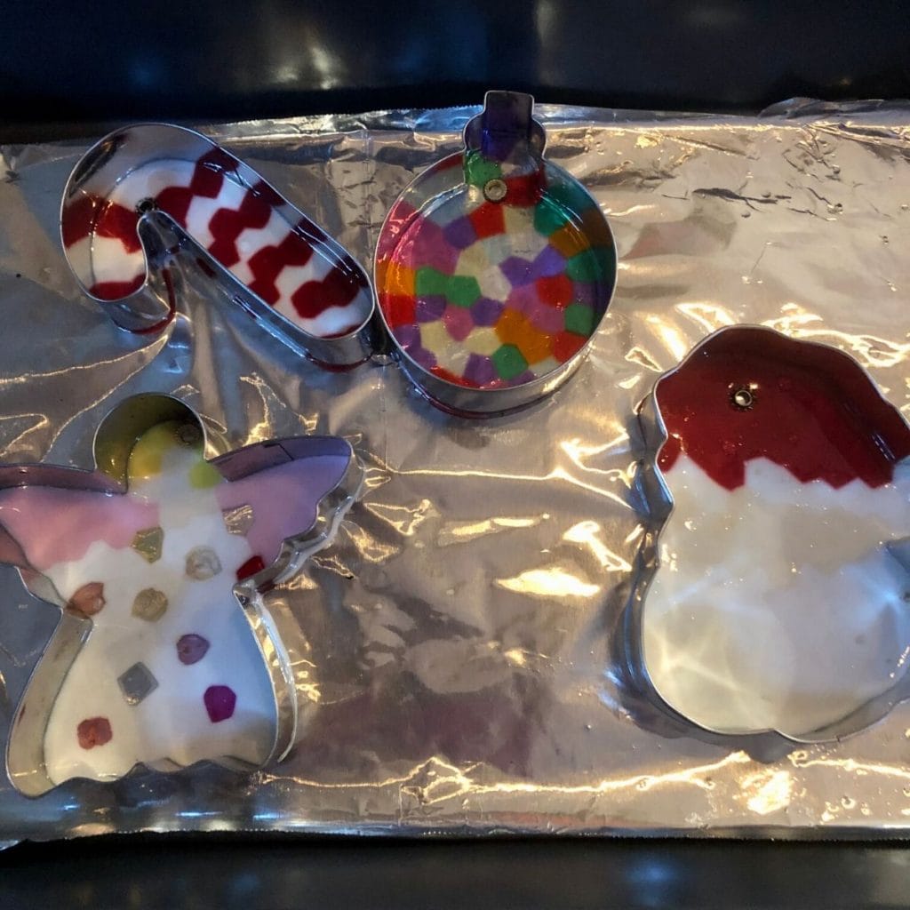 Christmas themed cookie cutters with melted beads i