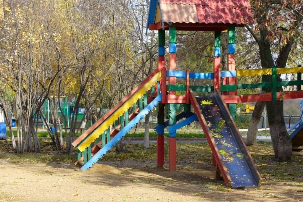 A colorful wooden playground at a campground 