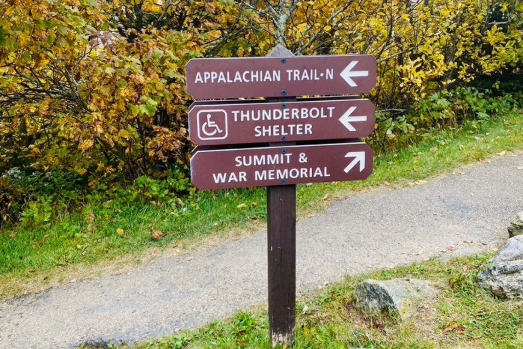 A sign post showing which way to walk if you want to hike the Appalachian trail or go to the summit of Mt Greylock