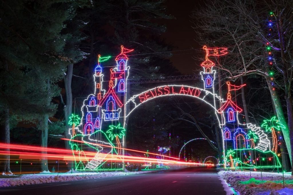 A lit up drive through tunnel of Seuss Land at night